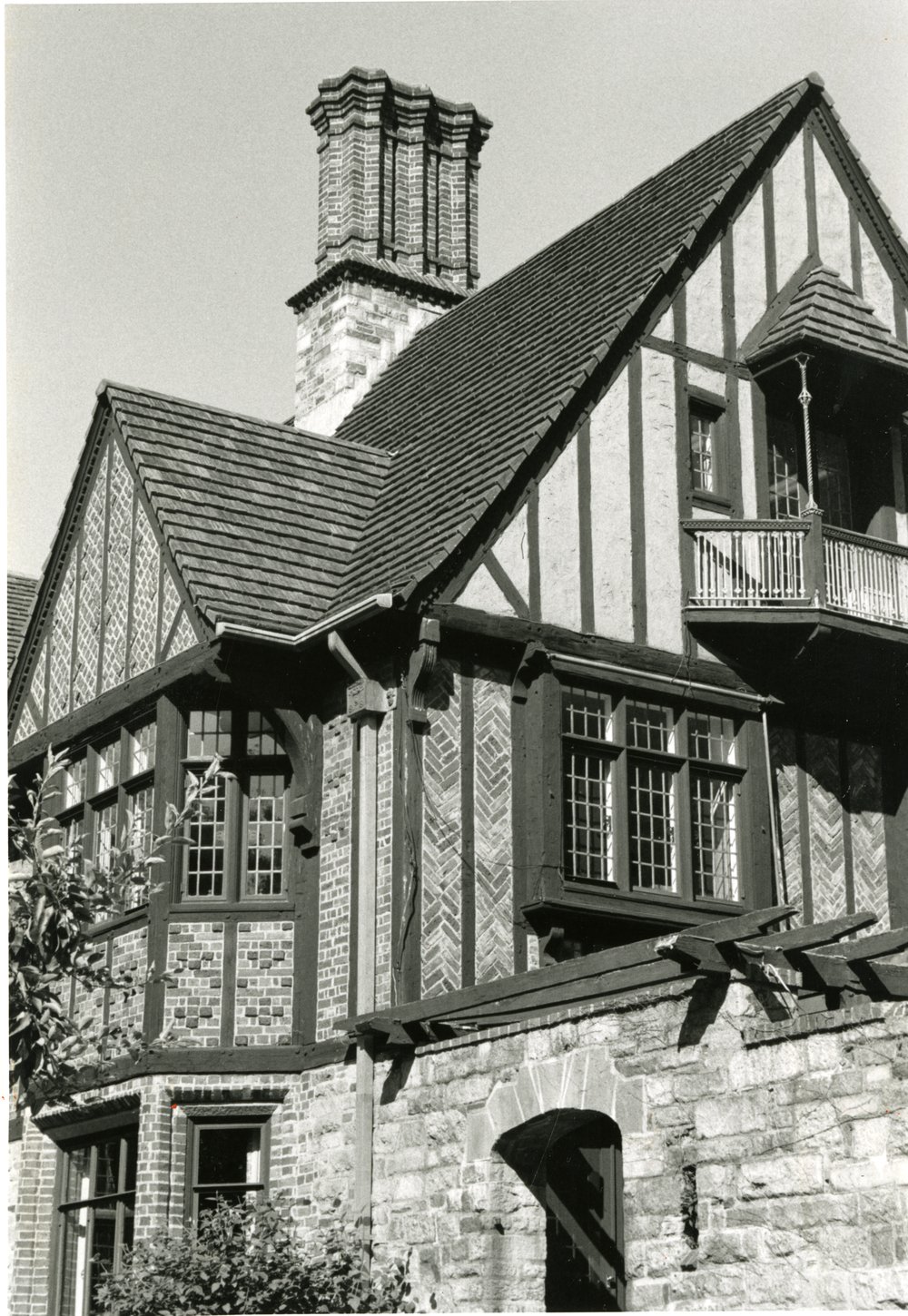 The Higgins House  with its multiplicity of materials, half-timbered gables, and one of its five ornamental brick chimneys on display